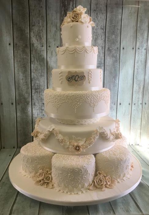 Extra large Elegant hand piped wedding cake with sugar flowers  and hand pained