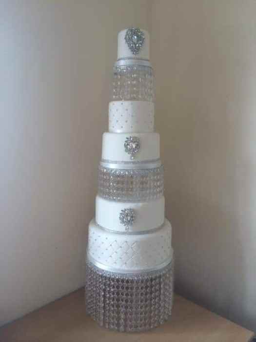 Extra large wedding cake on a crystal stand