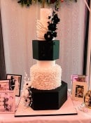 Extra large wedding cake with hexagonal tiers and ruffles 