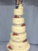 Extra large wedding cake Disney Mickey and mini cake topper sugar Roses on the corner and they lived happily ever after