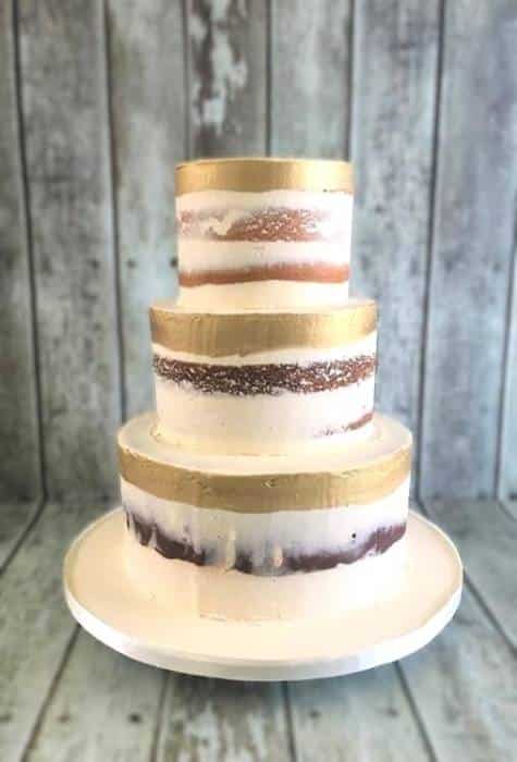 hand painted gold semi naked wedding cake