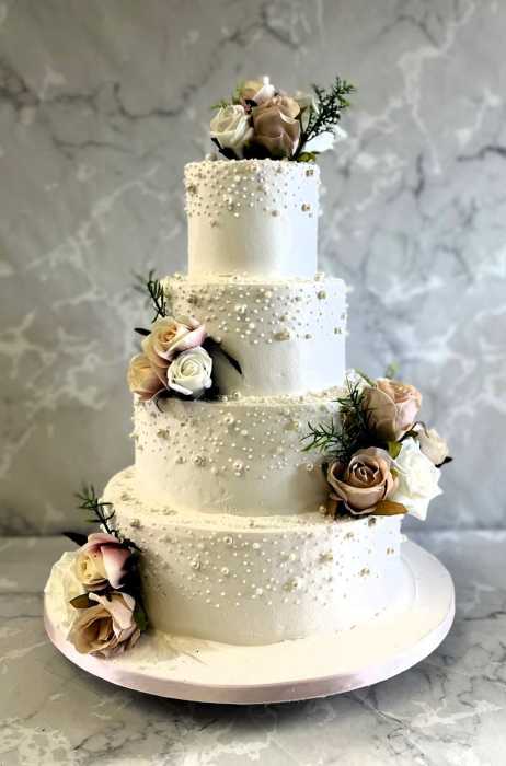 Blush-pink-buttercream-wedding-cake-with-edible-pearls-
