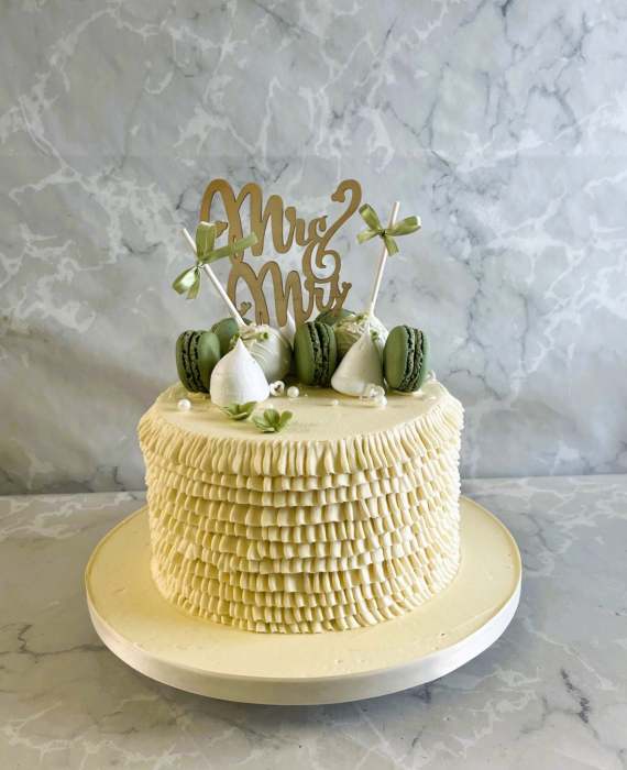 Buttercream had piped frills wedding cake