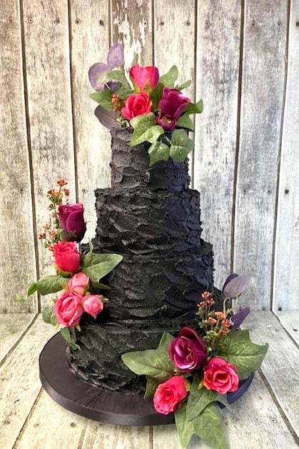Black-buttercream wedding cake -and-silk-flowers-