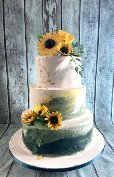 buttercream-with-habd-painted-green-and-yellow-with-sugar-sunflowers-