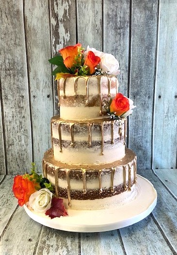 buttercrem-wedding-cake-with-gold-chocolate-drip-sand-silk-flowers-