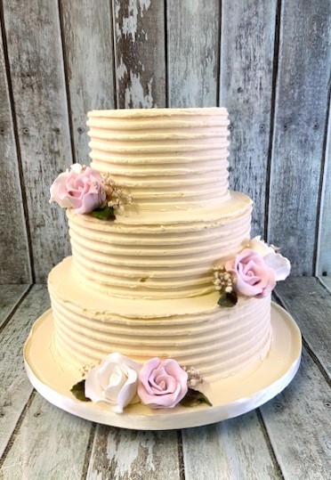 combed-buttercream-wedding-cake-with-sugar-flowers-