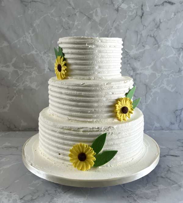 combed-buttercream-wedding-cake-with-sugar-sunflowers-