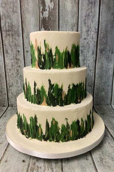 rustic-buttercrem-with-a-green-forest-design-wedding-cake-