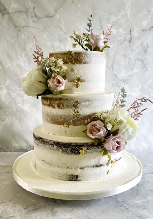 semi-naked-buttercream-wedding-cake-with-silk-flowers-
