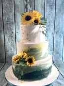 buttercream-with-habd-painted-green-and-yellow-with-sugar-sunflowers-
