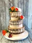 buttercrem-wedding-cake-with-gold-chocolate-drip-sand-silk-flowers-