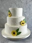 combed-buttercream-wedding-cake-with-sugar-sunflowers-