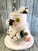 combed-buttercrem-wedding-cake-with-silk-flowers-and-macroons-