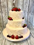 rustic-buttercrean-wedding-cake-with-hand-made-truffle-fruits-