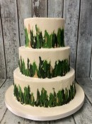 rustic-buttercrem-with-a-green-forest-design-wedding-cake-