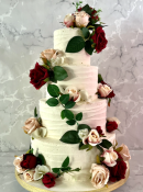 silk-flowers-on-a-vine-on-a-buttercream-wedding-cake-