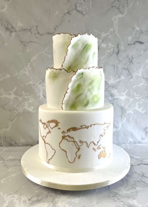 Green-hand-painted-wedding-cake-with-over-wrap-and-world-map-