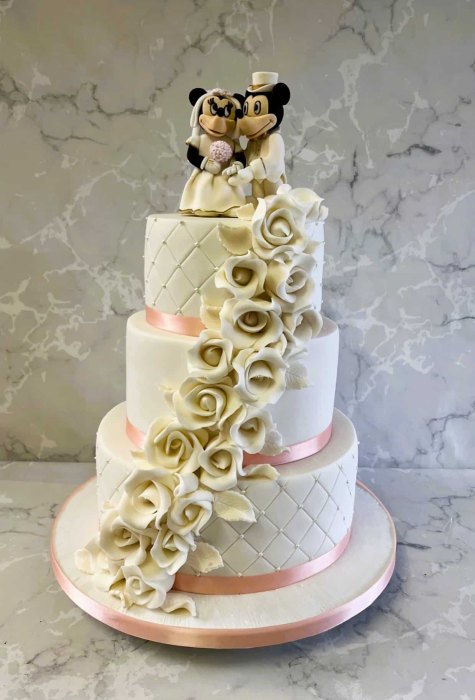 Hand-made-sugar-Mickey-and-Mini-cake-topper-on-cascading-sugar-roses-wedding-cake-
