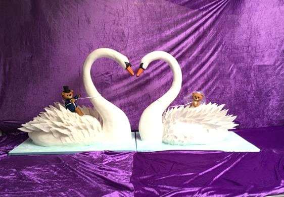 Life size swan cakes with sugar figures