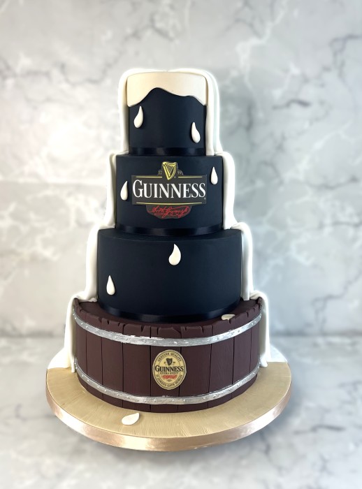 Guinness wedding cake four-tier with cream foam and barrel base