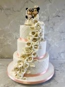 Hand-made-sugar-Mickey-and-Mini-cake-topper-on-cascading-sugar-roses-wedding-cake-