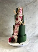 Peeled back Dark green icing revealing Marbling and gold  With Harry Potter and Beauty and the Beast  hod 