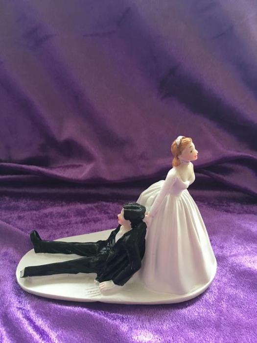 bride dragging groom cake topper