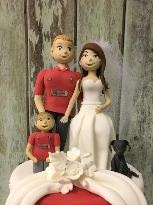 football themed family wedding cake topper made in sugar