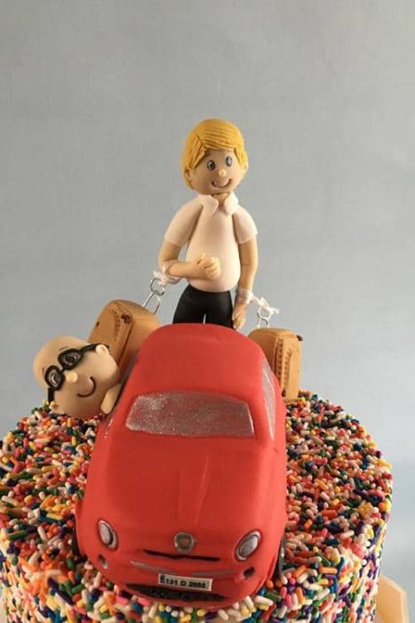 2 grooms  wedding cake topper and a car