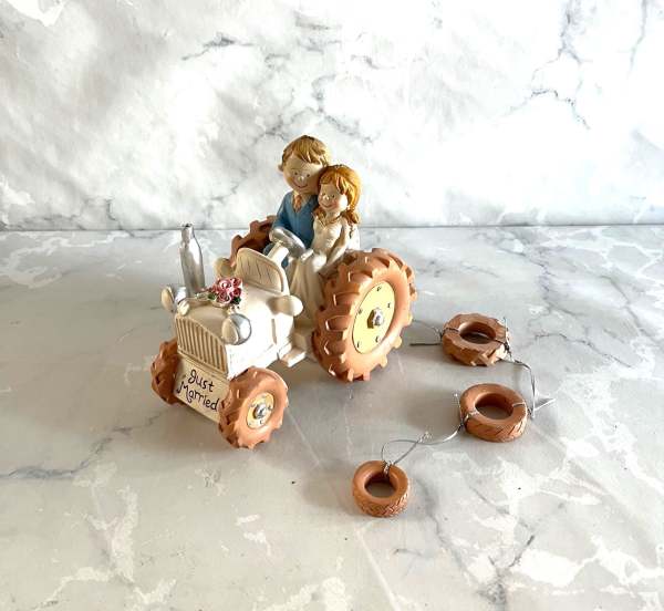 Funny Bride and Groom on a Tractor wedding cake topper