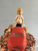 2 grooms  wedding cake topper and a car