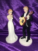 bride and groom playing guitar wedding cake topper