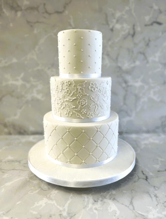 Delicate hand piped wedding cake