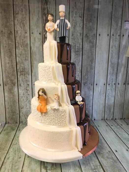 Brown and white wedding cake with chocolate drip