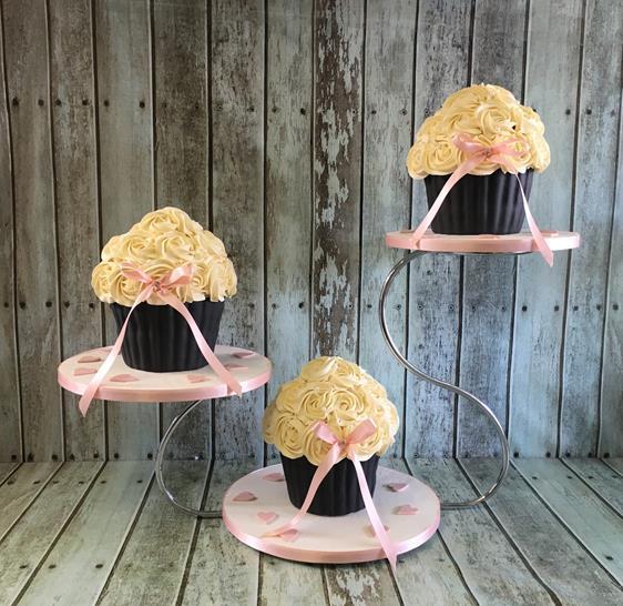 3 big muffin wedding cakes on a stand
