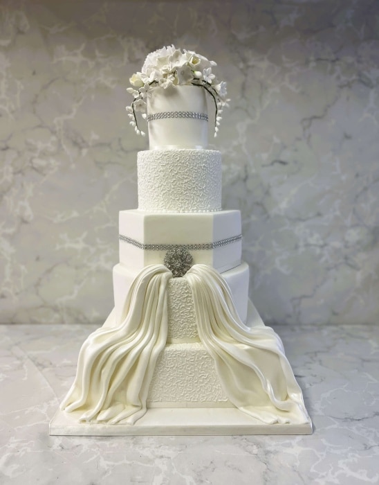 Elegant wedding cake with different shaped tiers