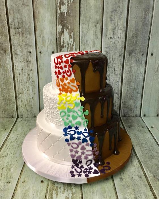 split chocolate drip wedding cake with vibrant colours