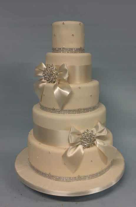 Crystal wedding cake with white satin bows and Diamante