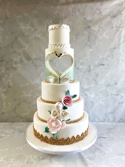 Hollow hear Swan wedding cake with vintage sugar flowers