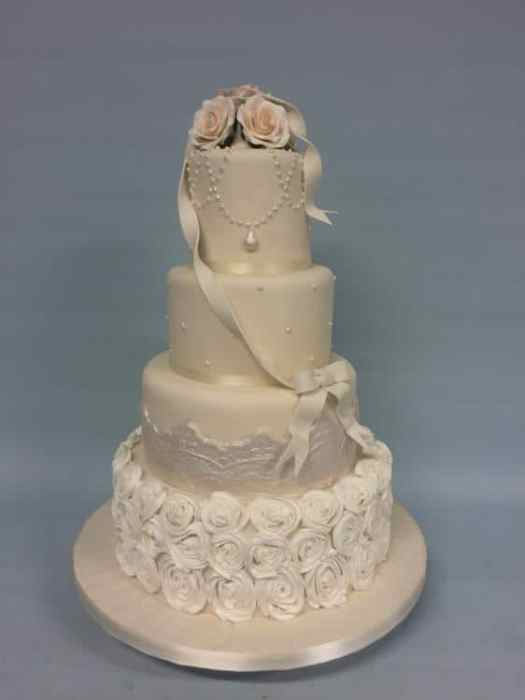 white rosettes and pearls Wedding cake
