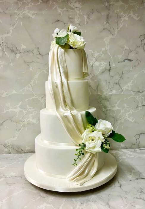sugar Satin Drape wedding cake with Silk flowers