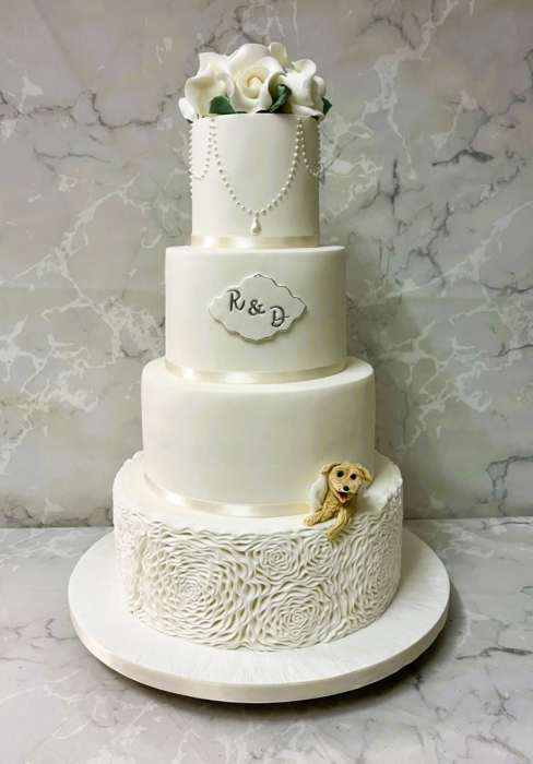 Sugar embossed Rosettes wedding cake with pearls and sugar peeping Dog