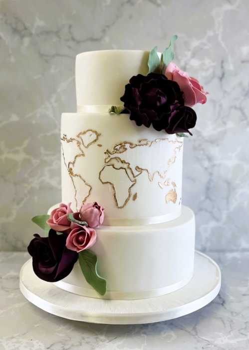 World-map-and-hand-made-sugar-roses-and-Peony-flowers-wedding-cake-
