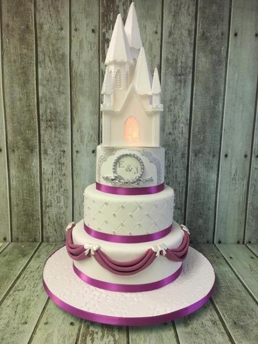 caste wedding cake with sugar drapes