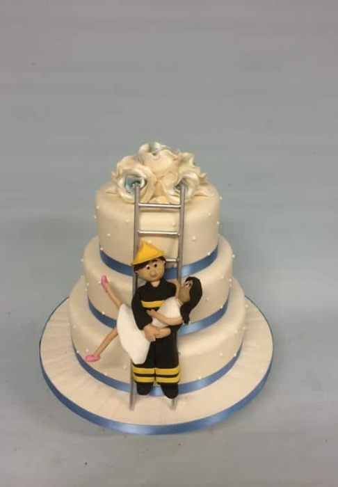 fireman wedding cake with sugar couple