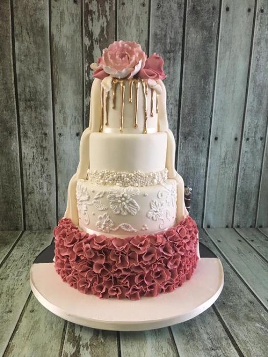 gold drip wedding cake with pink vintage ruffles