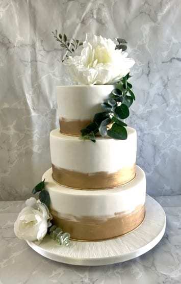 hand-painted-gold-bands-and-silk-flowers-wedding cake