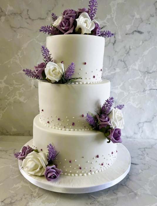 iced-wedding-cake-with-hand-piping-and-silk-flowers-