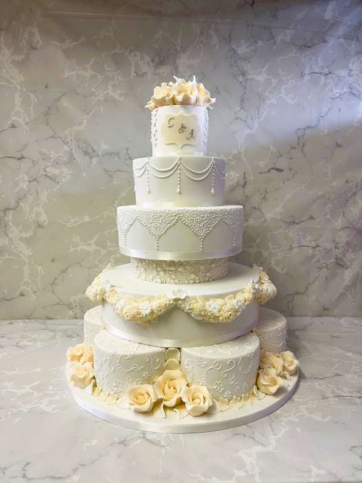 large-wedding-cake-hand-piped-with-sugar-roses-and-initals-